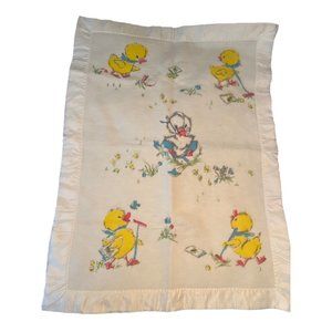Vintage baby blanket with ducks on it